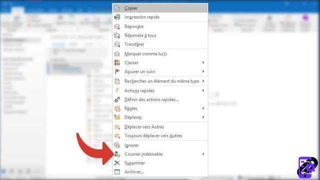 How do I report an email address as spam in Outlook?
